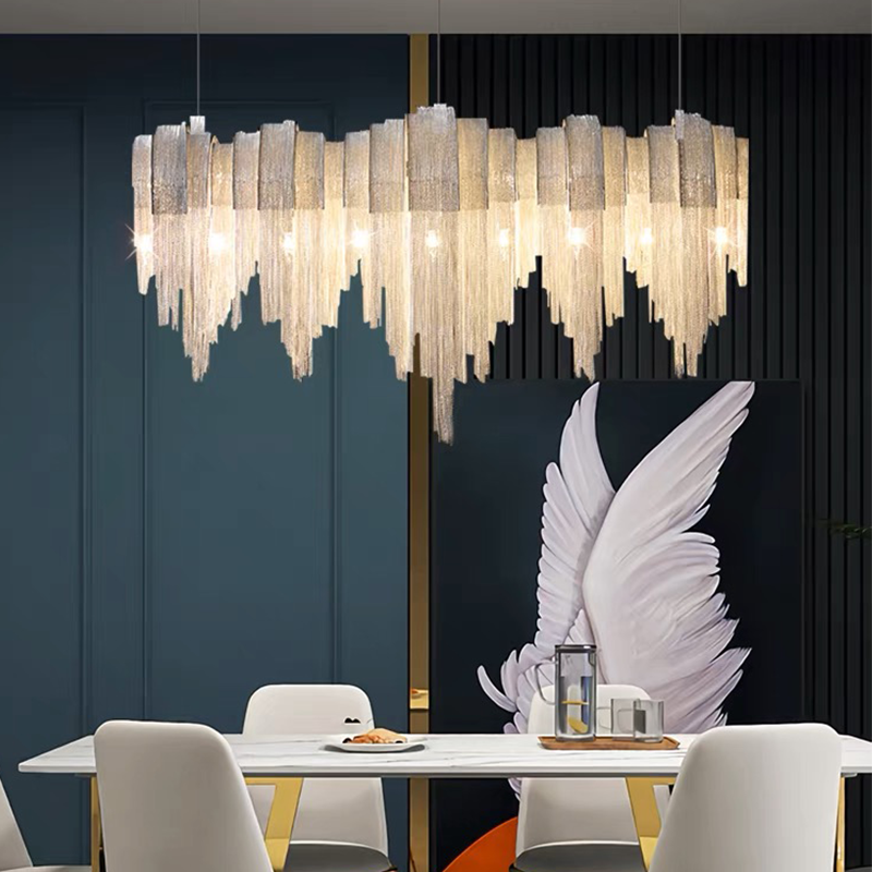 Dining Room Chandelier hanging above a a modern dining area 