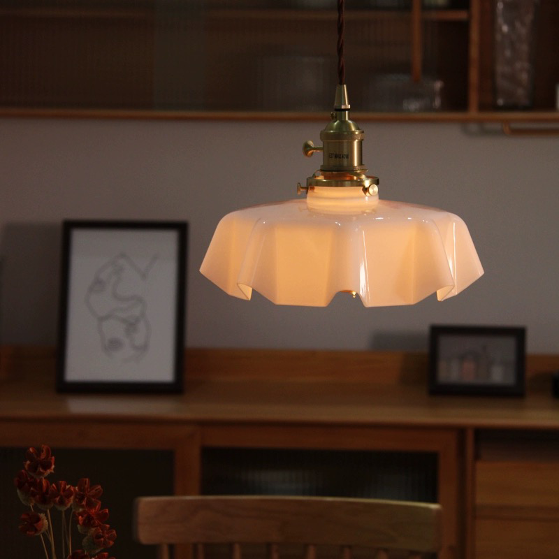 a kitchen island pendant light hanged from above