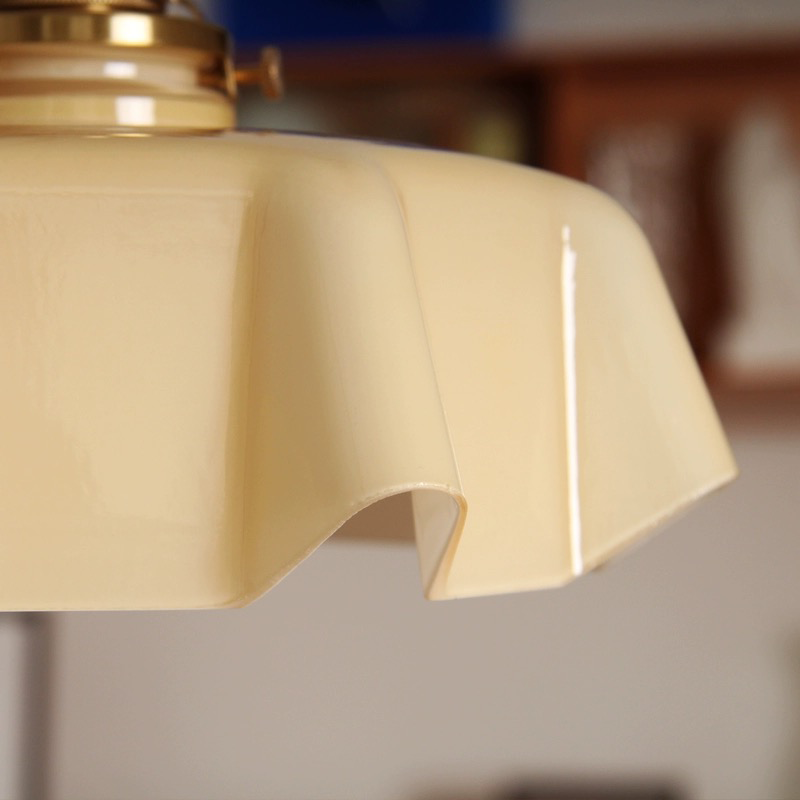 a kitchen pendant light placed on a dining table