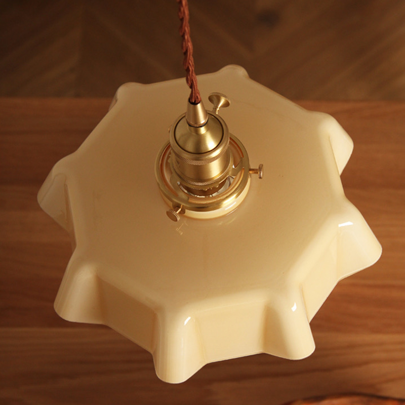 an illuminated kitchen pendant light in different settings 