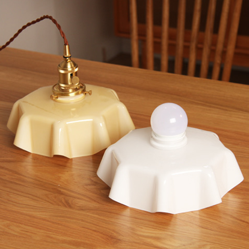 a kitchen pendant light in a cream color, and white color