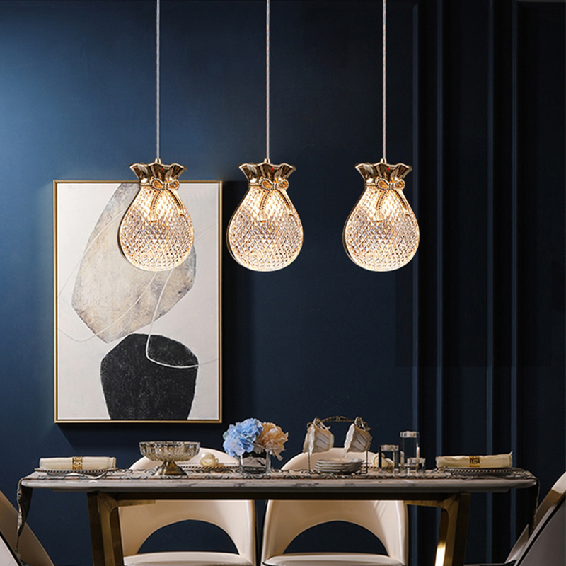 Kitchen pendant light hanging above a modern dining set 