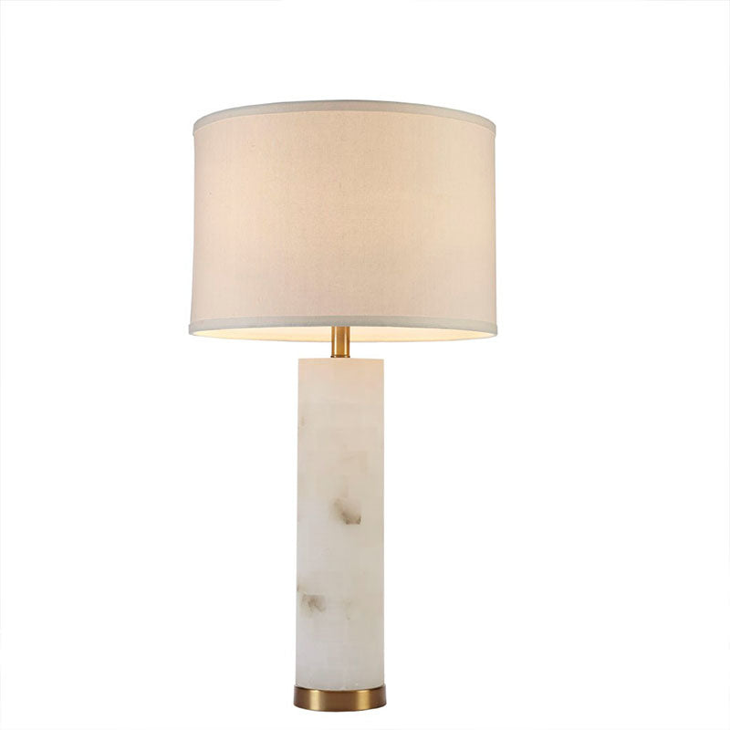 an illuminated ceramic table lamp in a white background