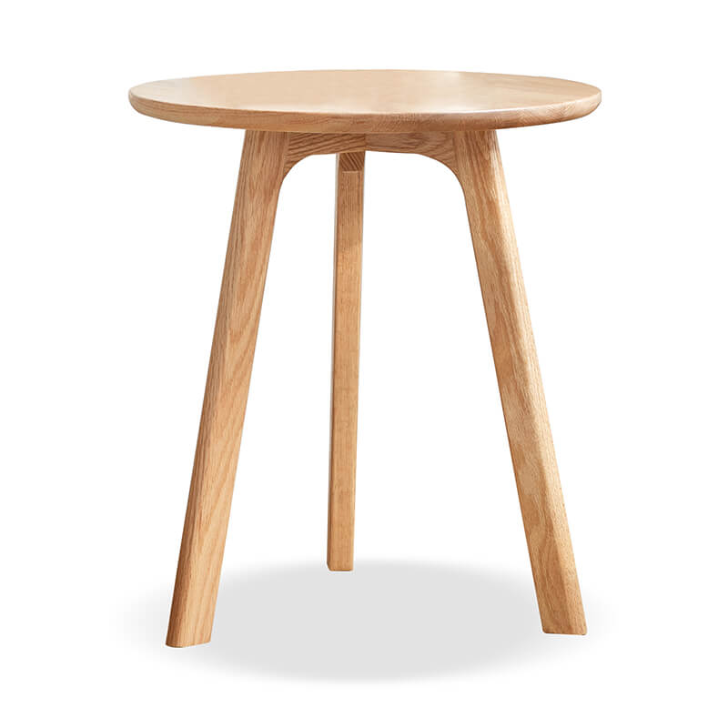 a round wood end table in a white background