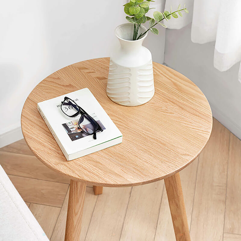 a round wood end table showcasing the smooth table-top