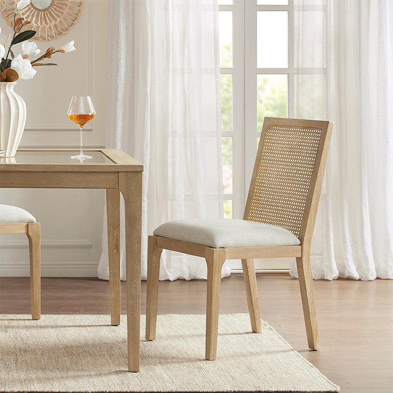 Wood dining chair with full cane back in a dining room setting