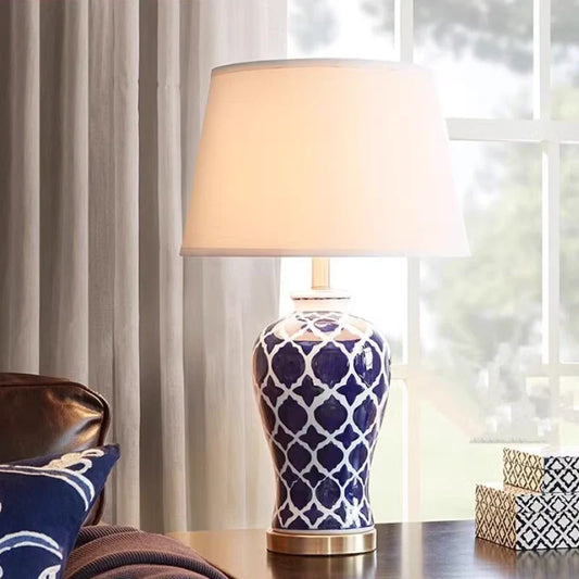 a vintage hand-painted blue ceramic table lamp set in a contemporary living room