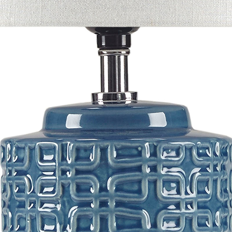 Close up view of ceramic table lamp highlighting geometric patterns and table lamps neck