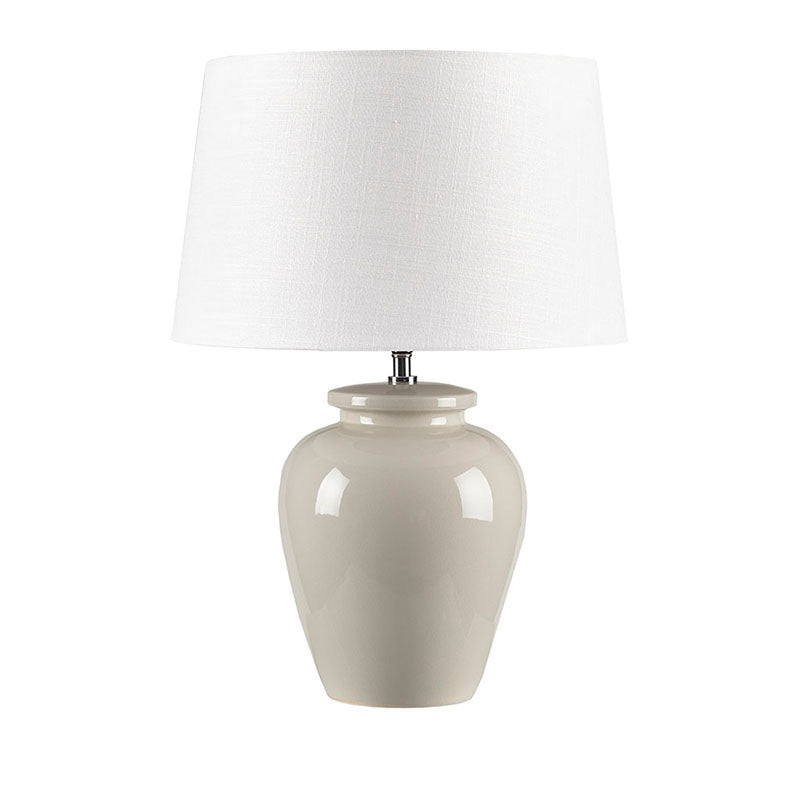 a large ceramic table lamp in a white background