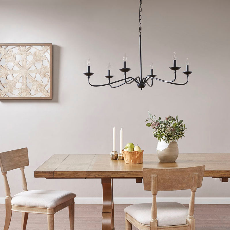 Farmhouse dining chandelier hanging above a traditional dining space