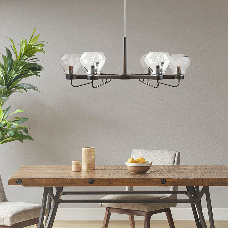 a black chandelier dining room in a modern setting