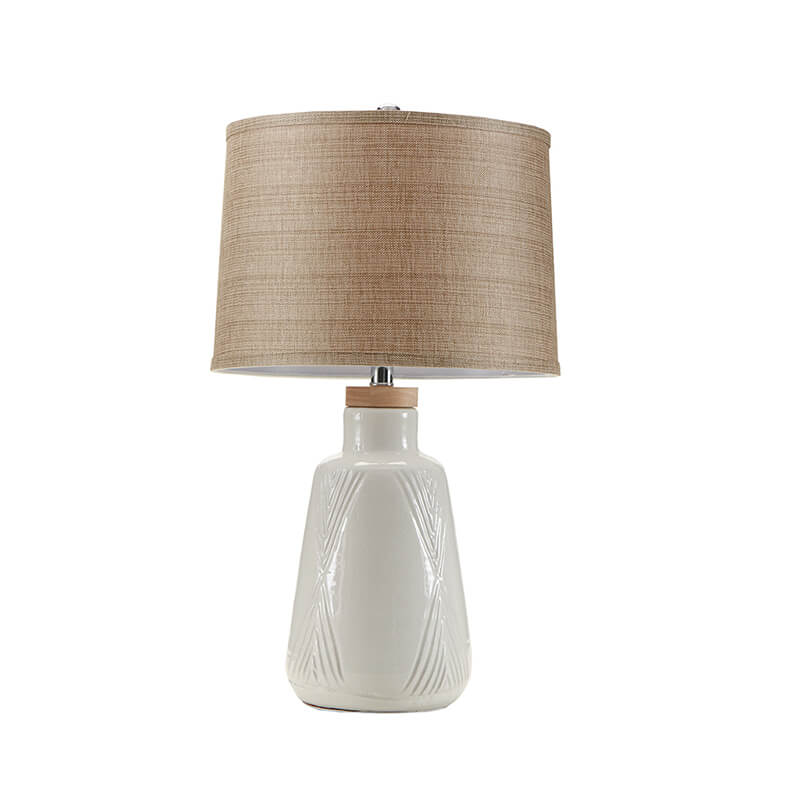 Full view of the ceramic table lamp with white base and natural shade turned off