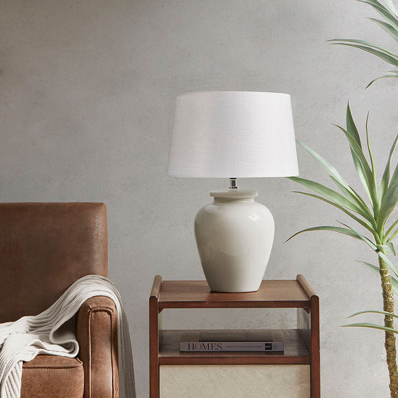 a modern ceramic table lamp placed elegantly on a side table