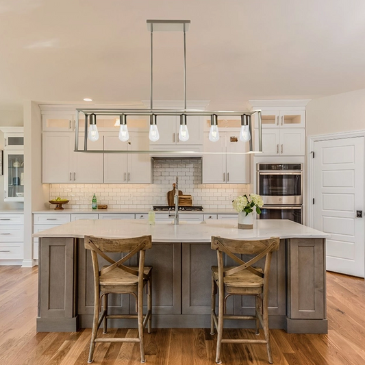 A Modern Rectangular Linear Dining Room Chandelier suspended above a kitchen island