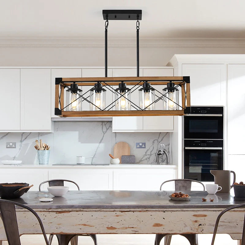 a rustic chandelier over a kitchen island