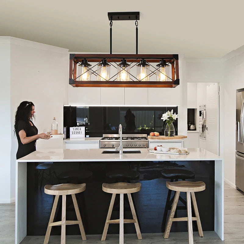 a rustic chandelier over a kitchen island