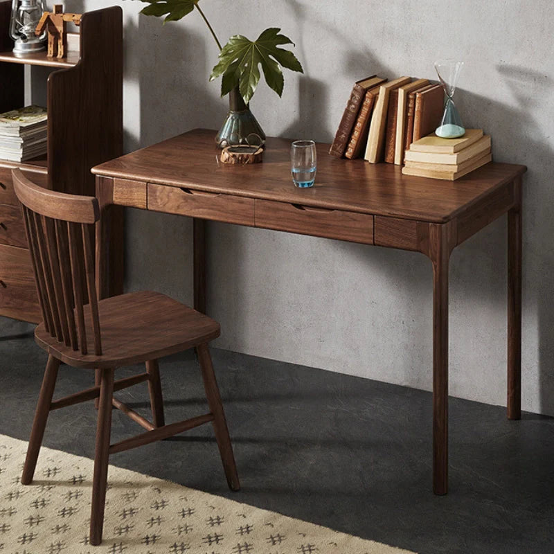 a retro wooden desk with drawers paired with a matching chair