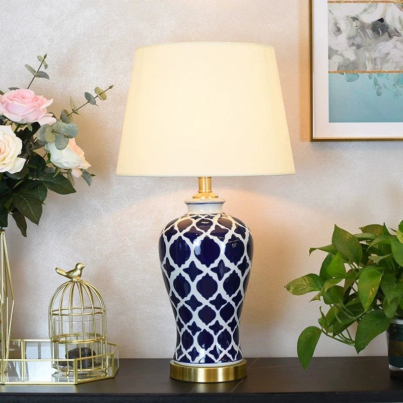 a vintage blue ceramic table lamp set on a table top