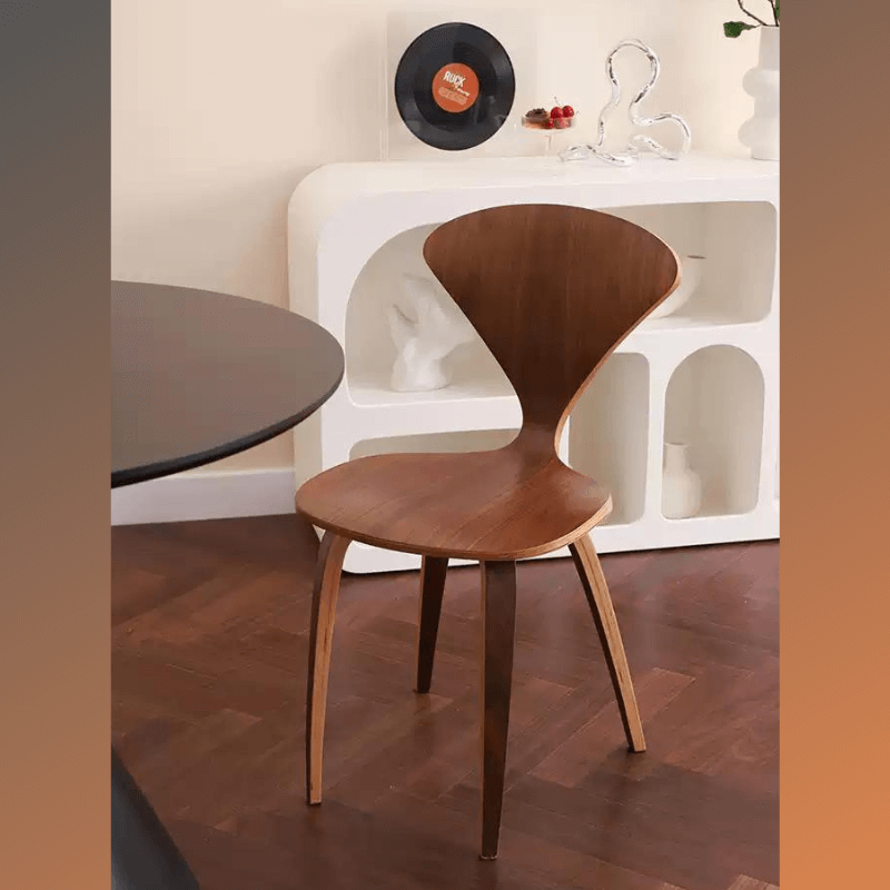 Front view of wooden dining room chair in a modern dining area