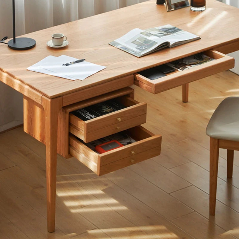 Up close view of storage drawers of wood office desk in natural wood finish 