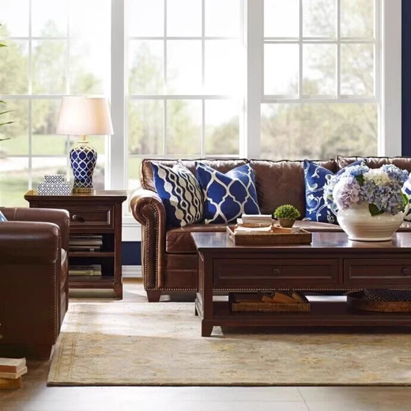 a ceramic table lamp placed on a side table in a living room