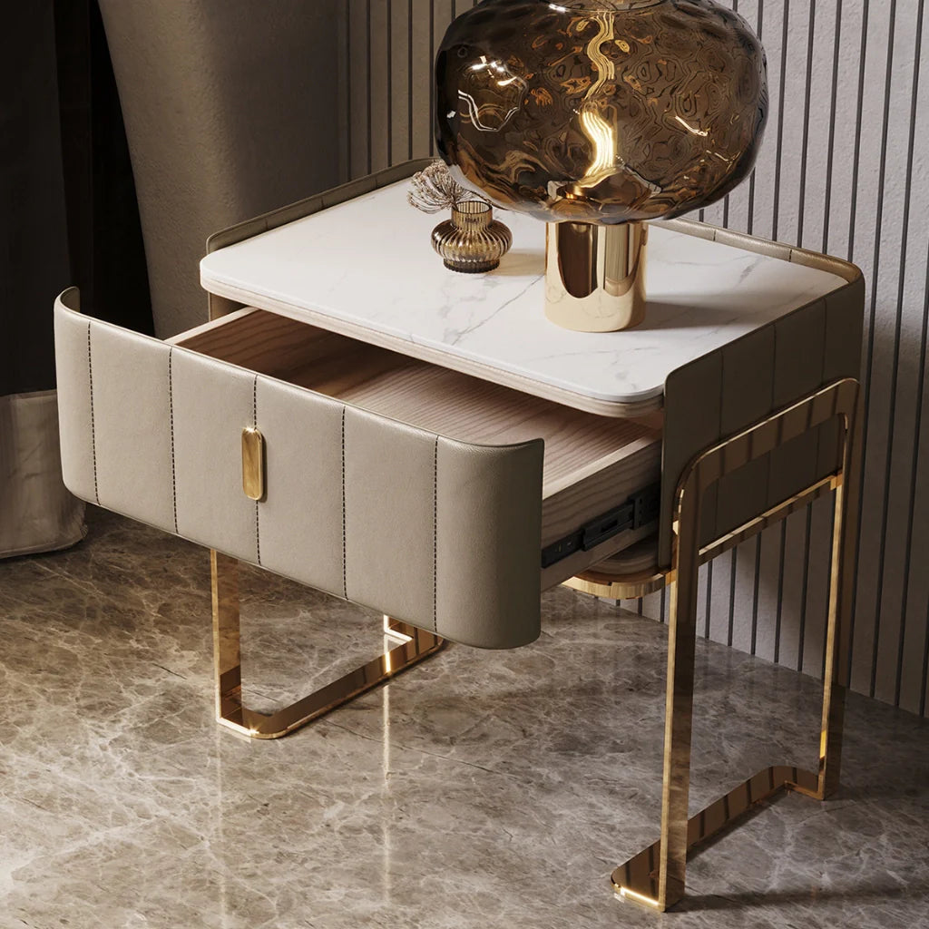 Modern Nightstand in Bedside table ideas showing its spacious single drawer, sintered stone top and gold legs.