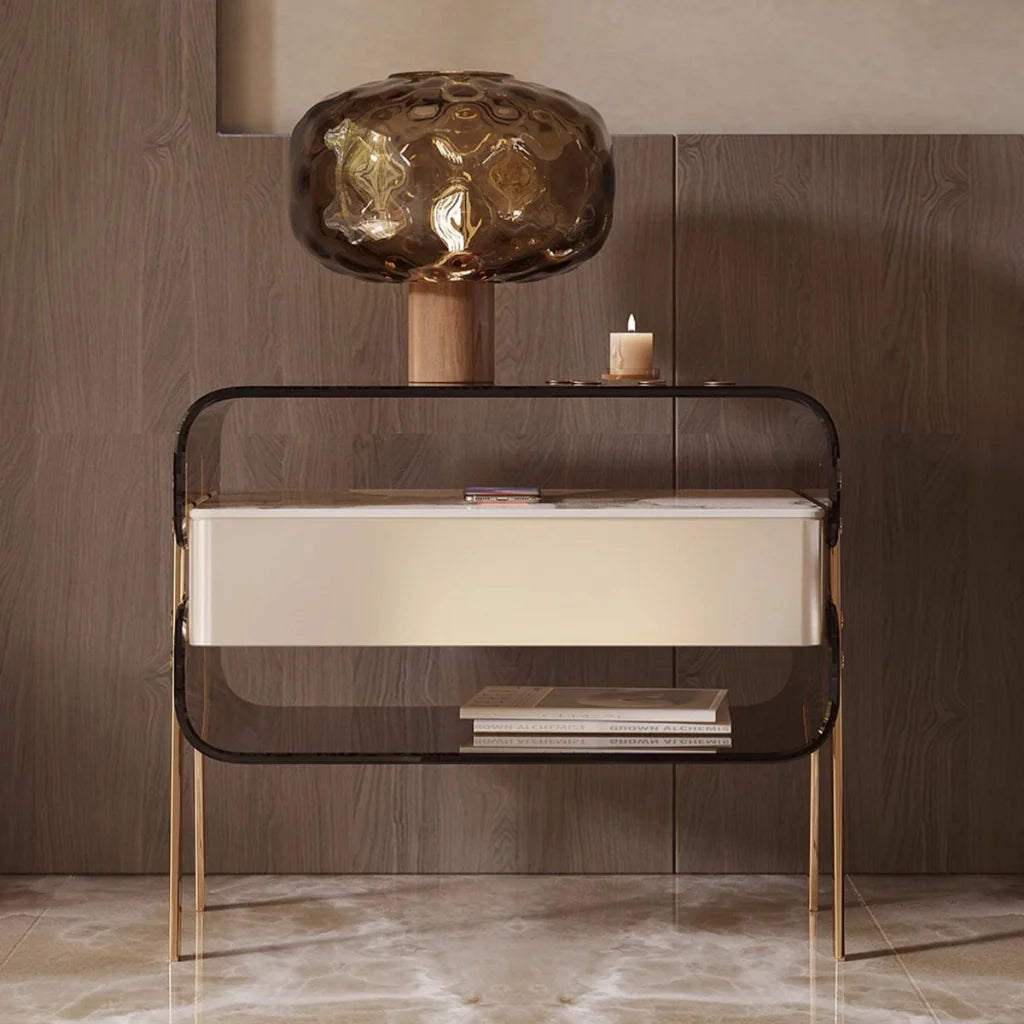 a modern acrylic nightstand featuring a single drawer with a smooth finish, and open shelving for books or other decor items.