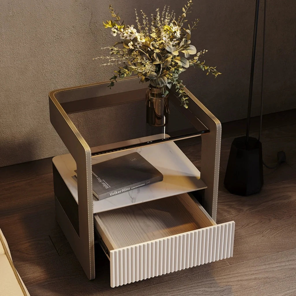 A minimalist modern nightstand image. Showcase its drawer and decorative stone and glass accents.