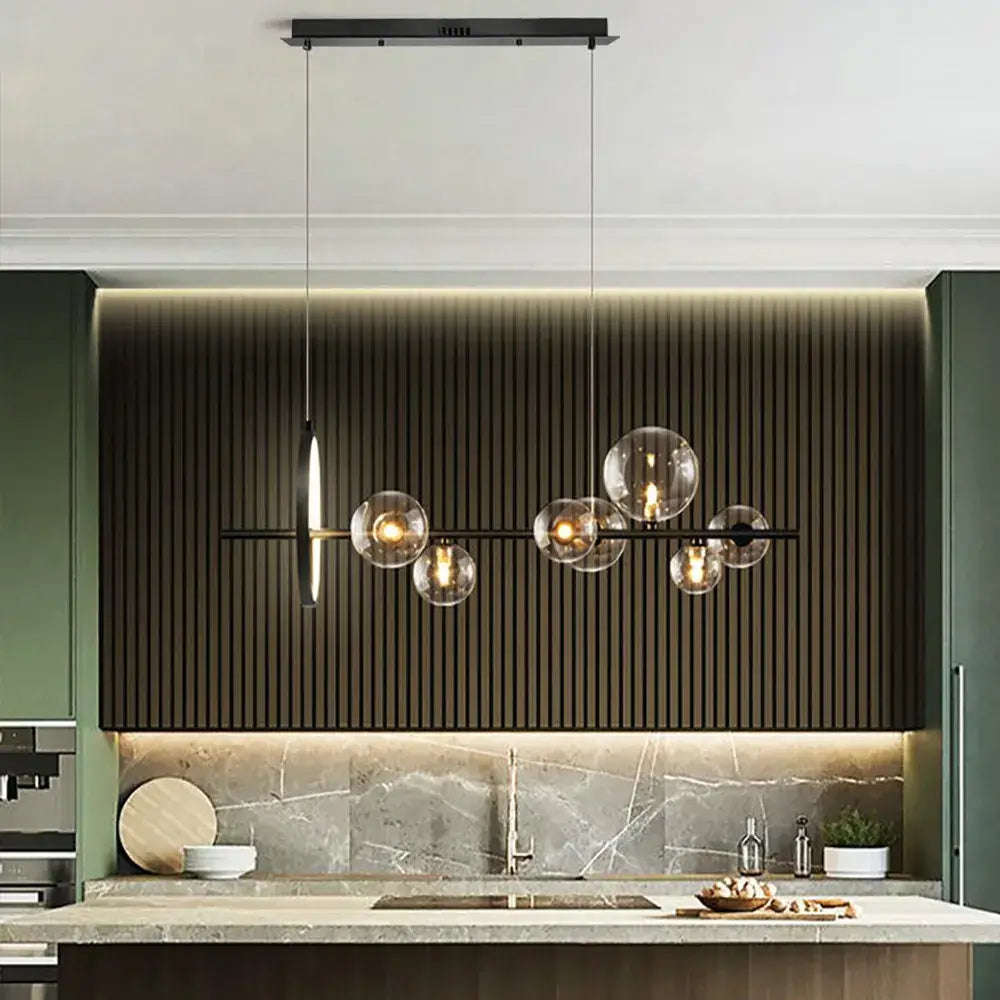 a chandelier over a kitchen island