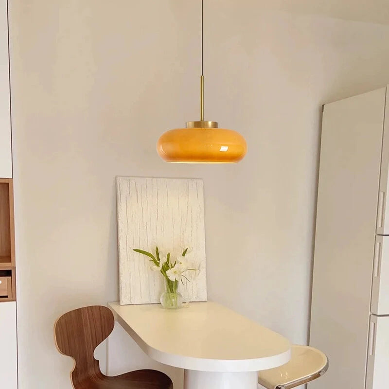 a vintage semi flush ceiling light, hanging above a table