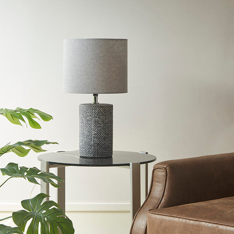 Ceramic table lamp on a side table in a modern living room