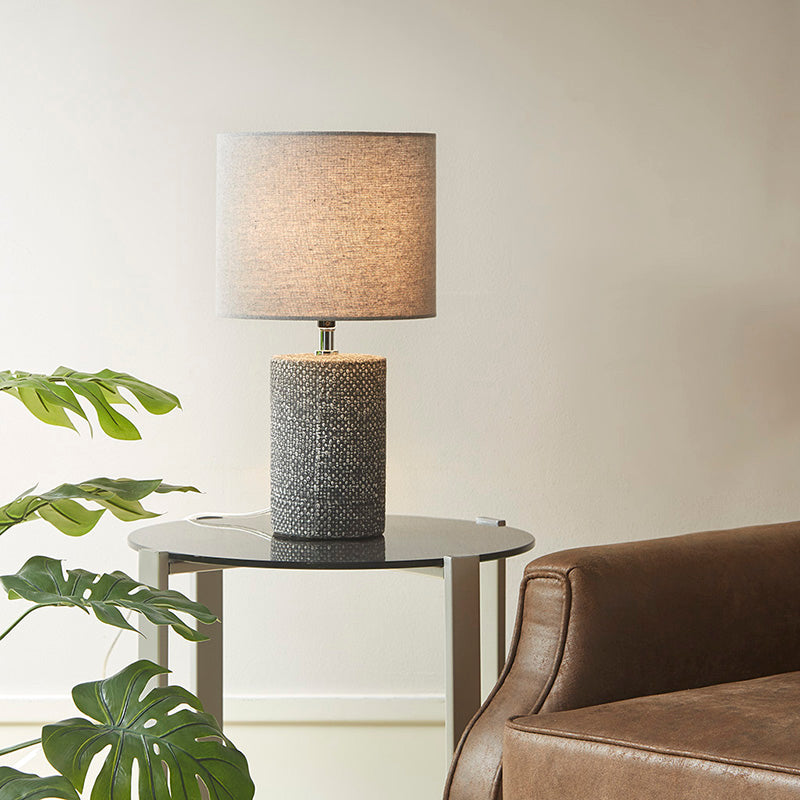 Ceramic table lamp on a side table in a modern living room