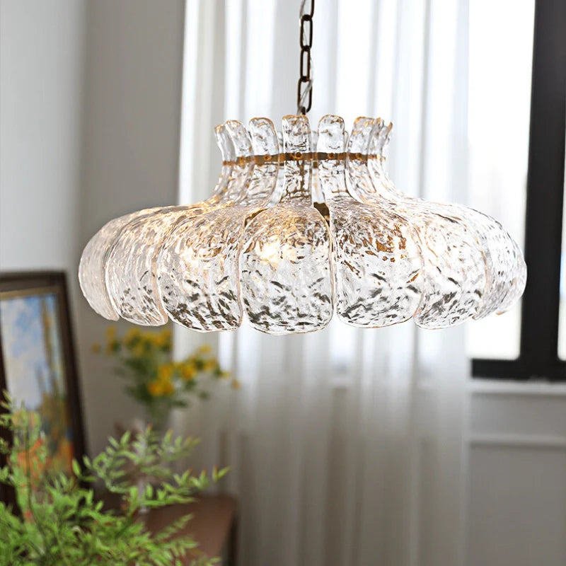 Island pendant light hanging above a brightly lit room