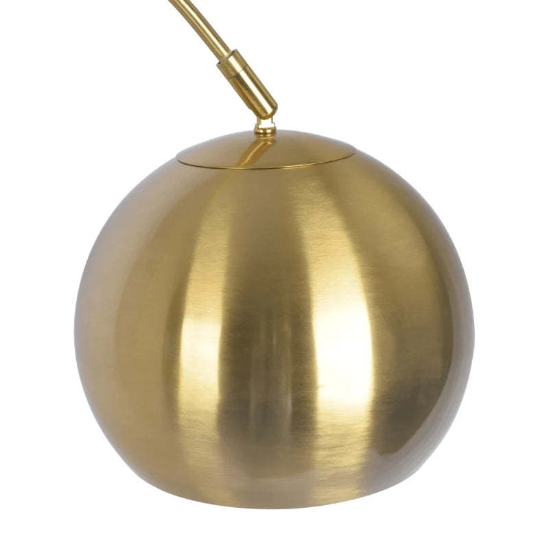 the brass shade of a modern floor lamp