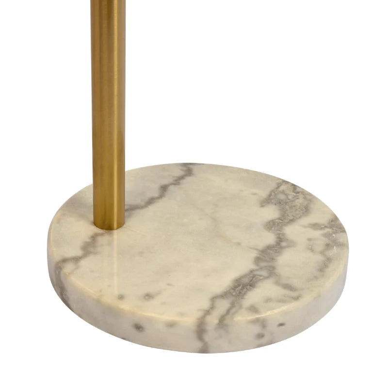 the marble base of a modern gold floor lamp