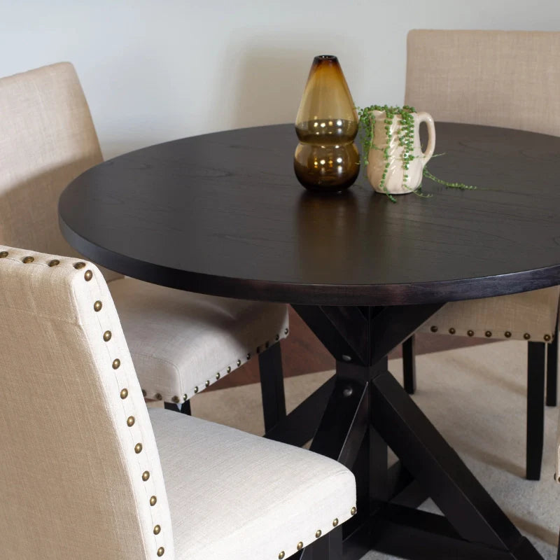 Round Wood Dining Table with Cross Buck Pedestal and Upholstered Nailhead Chairs