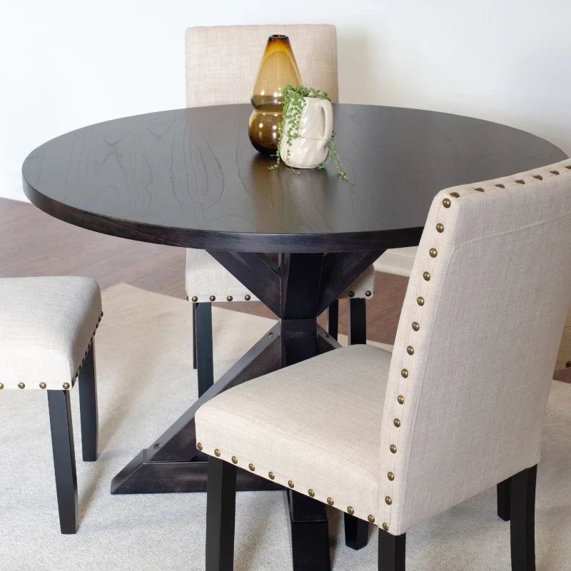 Black Wooden Dining Table with Upholstered Nailhead Designed Chairs.