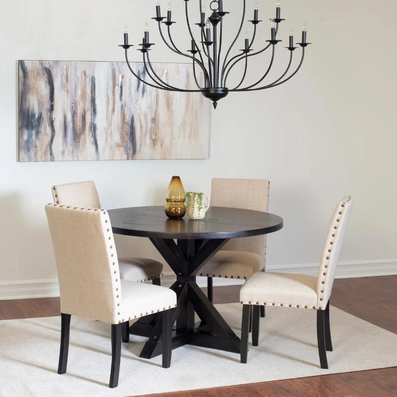 Round Wood Dining Table for 4 in a Modern Dining Room Setting with Minimal Décor