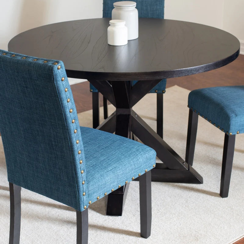 Round Wood Dining Table with Cross Buck Pedestal and Upholstered Nailhead Chairs