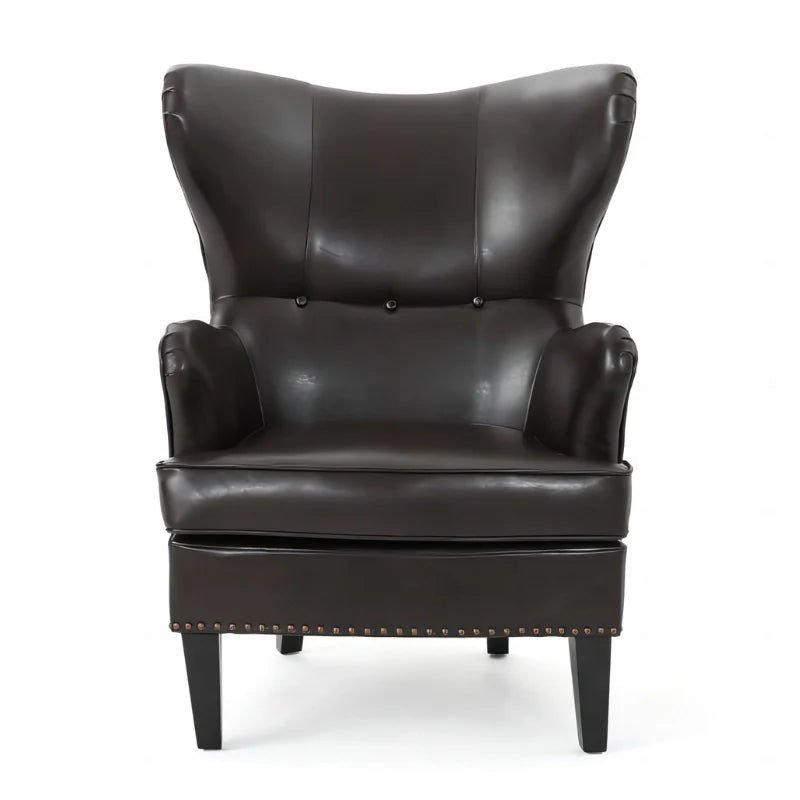 Brown leather accent chair with tuft wing back and sturdy legs