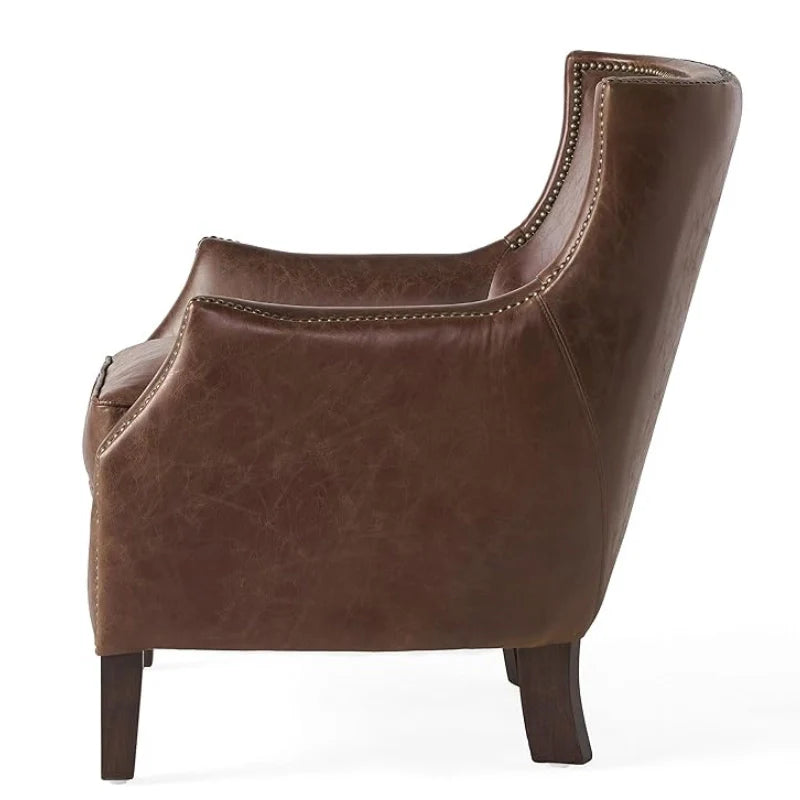 Side view of brown leather accent chair high lighting sturdy legs and rivet design