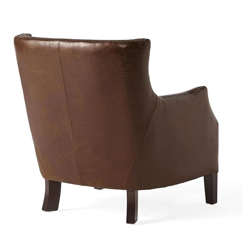 Back view of brown leather accent chair highlighting its sturdy wooden legs