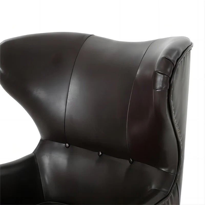 Dark brown leather accent chair highlighting tuft wing back design