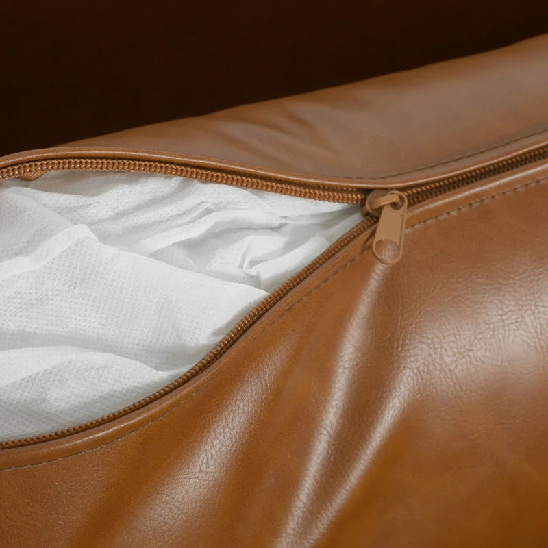 Brown leather lounge chair showing removable cushion cover