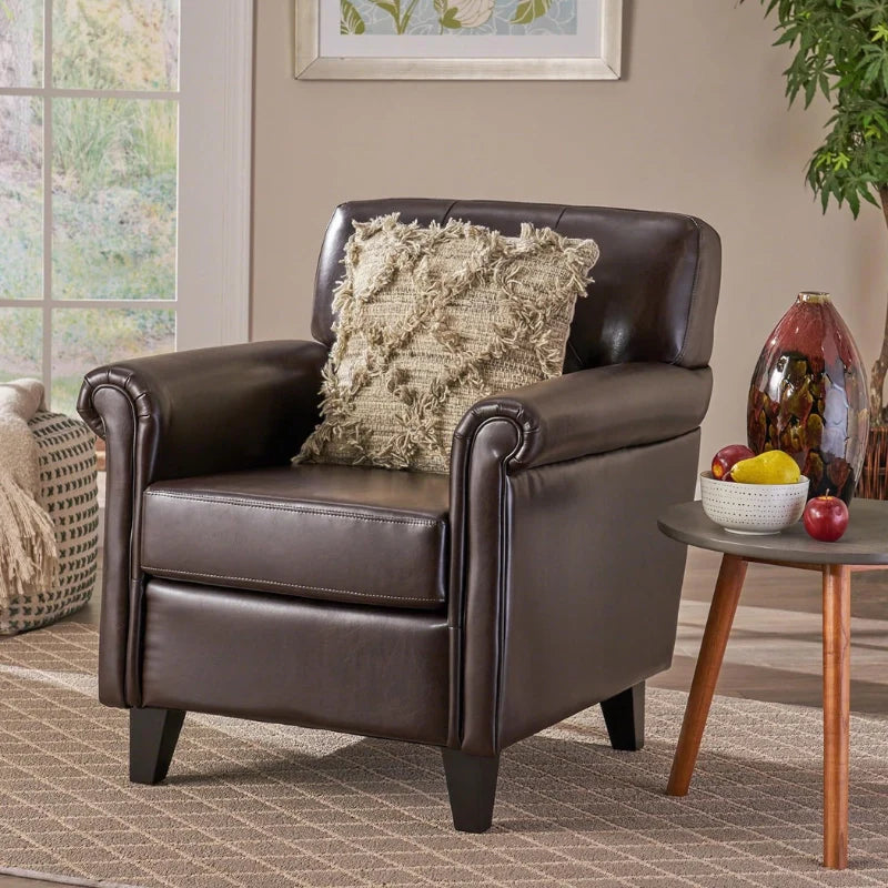 A brown leather accent chair in a modern living room 