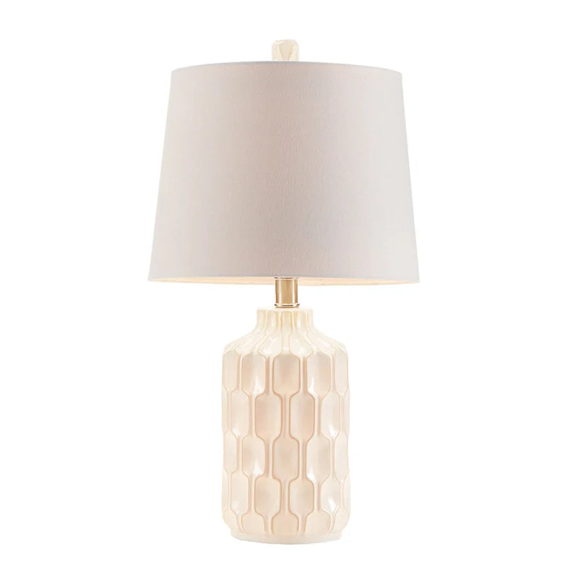 Full View of the Ivory and white ceramic table lamp with contoured base