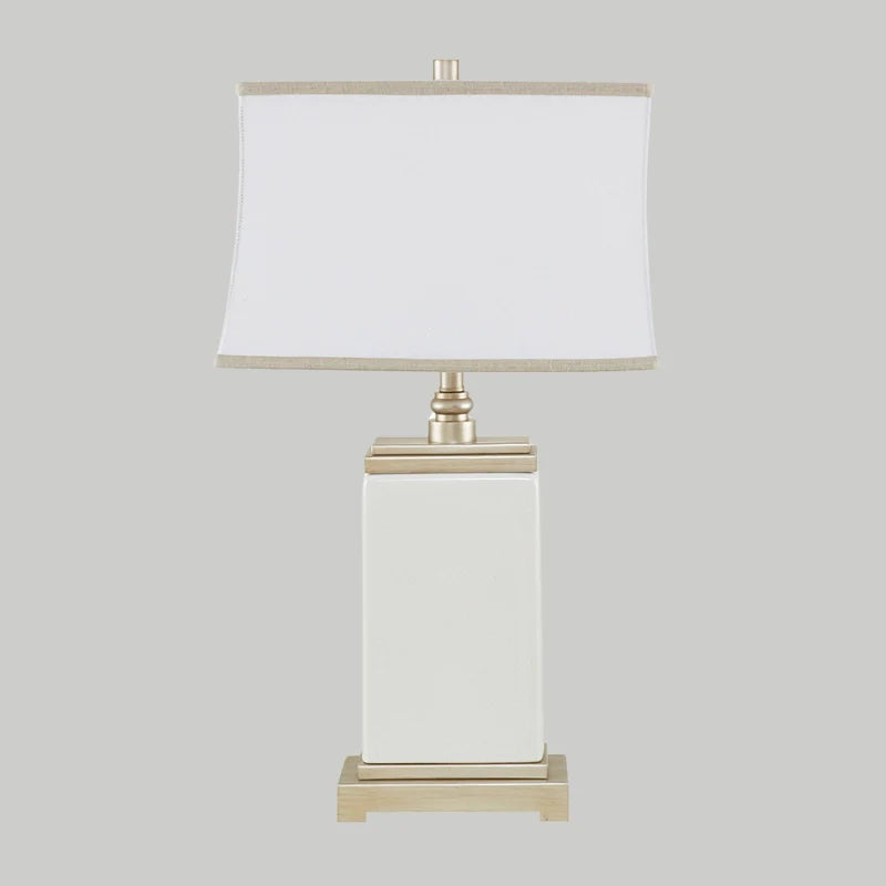 Full view of Ivory Ceramic table lamp turned off with rectangular base and lampshade