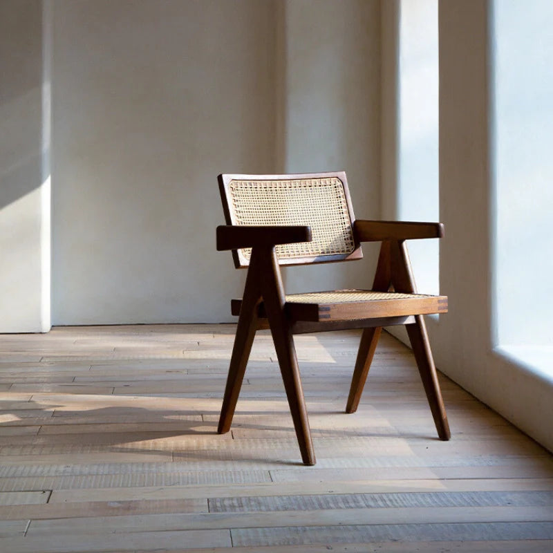 A Rattan Dining Chair with Cushions in a Stylish Living Area - CharmyDecor