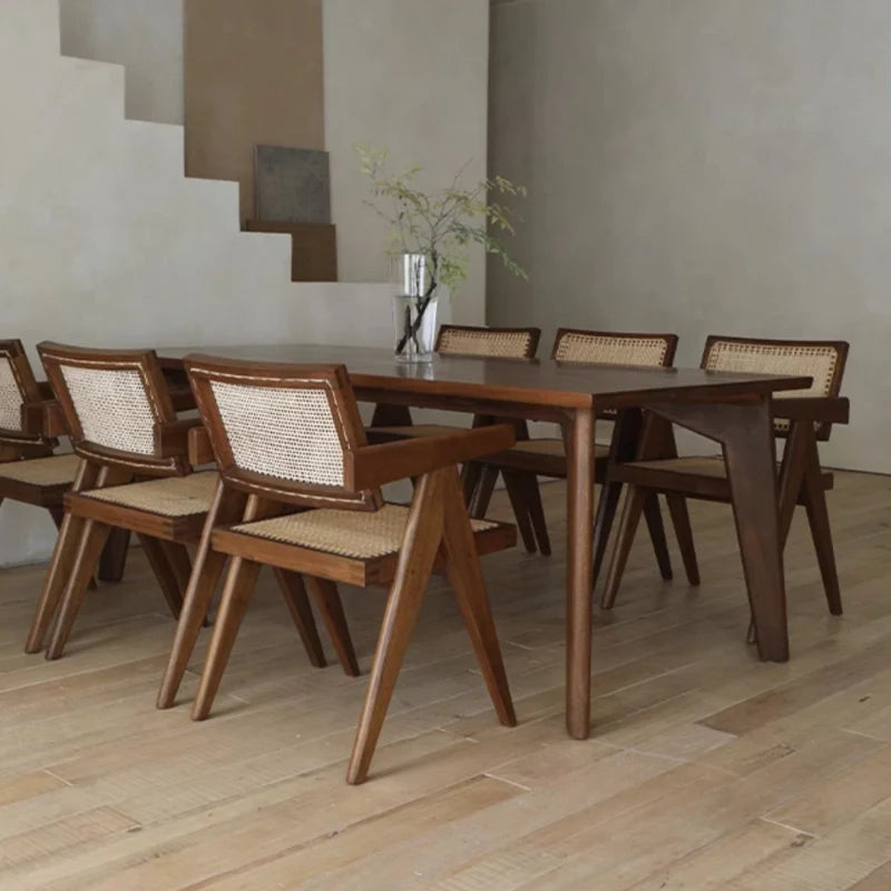 Rattan Dining Chairs placed around a Wooden Dining Table