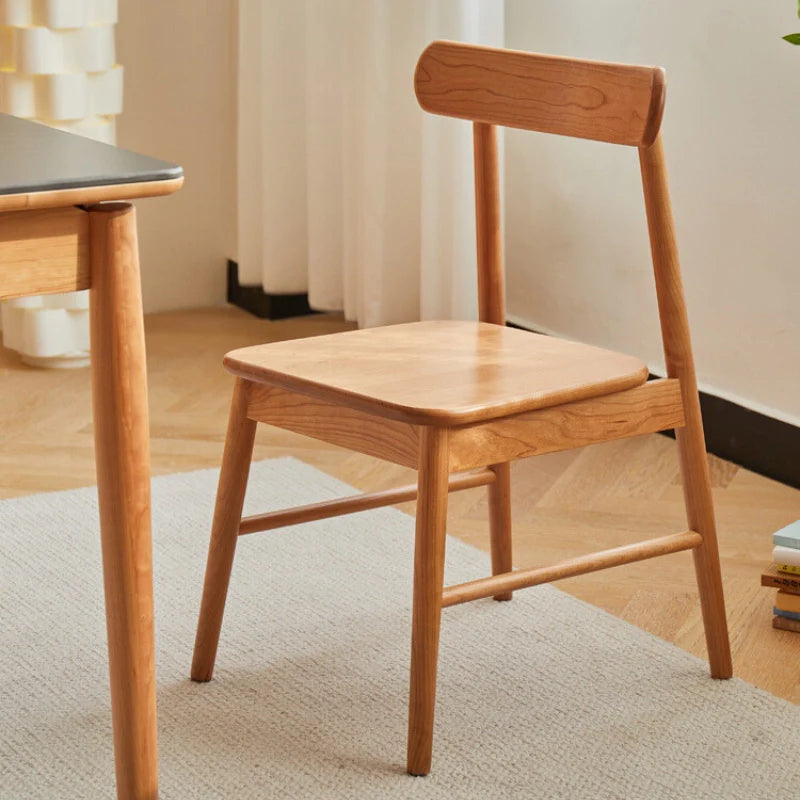 A Natural Wood Dining Chair in a Modern Living Room - CharmyDecor